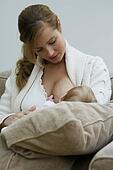 Women+breastfeeding+puppies